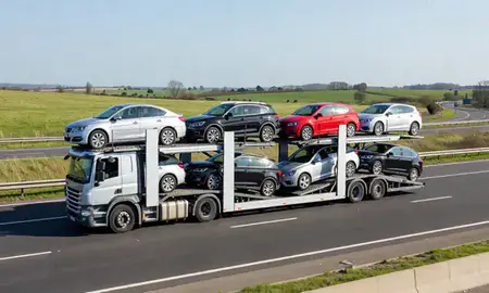 Multi-level car carrier on the motorway to Leighton Buzzard, Bedfordshire, United Kingdom