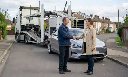 Vehicle owner beside their delivered car in Leighton Buzzard, Bedfordshire, United Kingdom