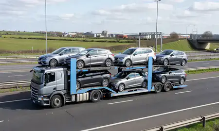 Multi-level car carrier on the motorway to Luton, Bedfordshire, United Kingdom