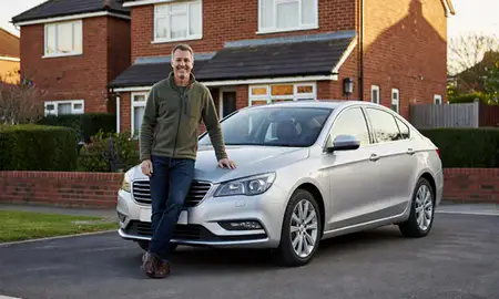 Customer with their delivered car in Luton, Bedfordshire, United Kingdom