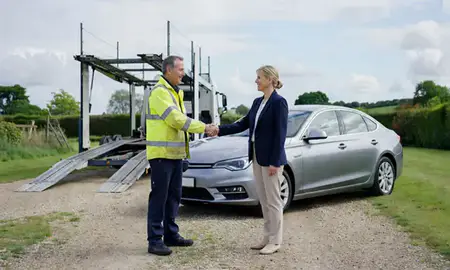 Vehicle owner beside their delivered car in Berkshire, United Kingdom