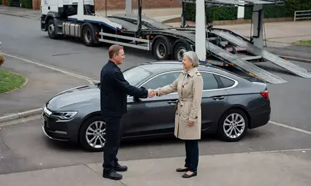 Vehicle owner beside their delivered car in Maidenhead, Berkshire, United Kingdom