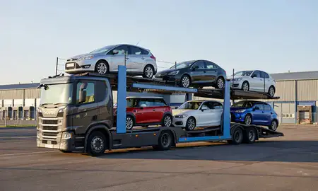 Car transporter loaded with vehicles in Newbury, Berkshire, United Kingdom