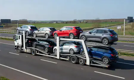 Multi-level car carrier on the motorway to Slough, Berkshire, United Kingdom