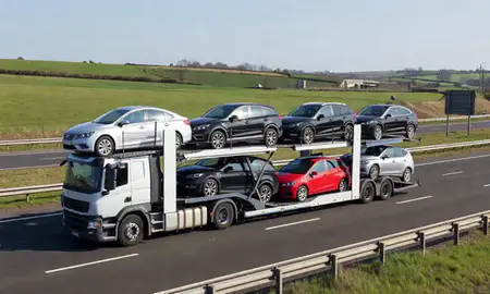 Multi-level car carrier on the motorway to Wokingham, Berkshire, United Kingdom