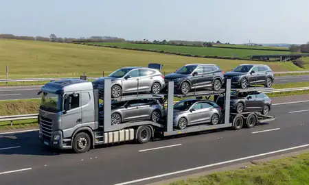 Multi-level car carrier on the motorway to Woodley, Berkshire, United Kingdom