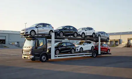 Car transporter loaded with vehicles in Woodley, Berkshire, United Kingdom