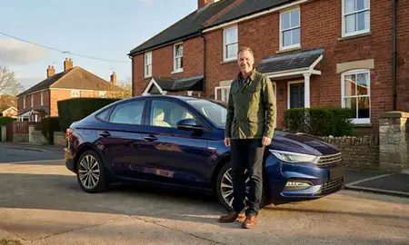 Customer with their delivered car in Bristol, United Kingdom
