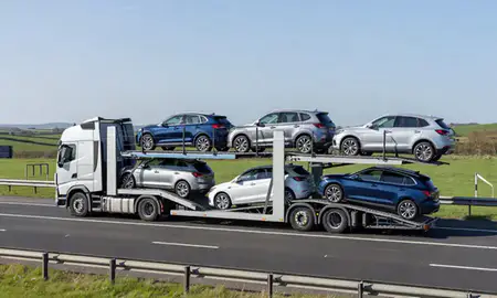 Multi-level car carrier on the motorway to Aylesbury, Buckinghamshire, United Kingdom