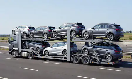 Multi-level car carrier on the motorway to Bletchley, Buckinghamshire, United Kingdom