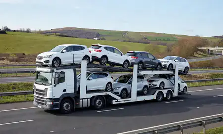 Multi-level car carrier on the motorway to High Wycombe, Buckinghamshire, United Kingdom