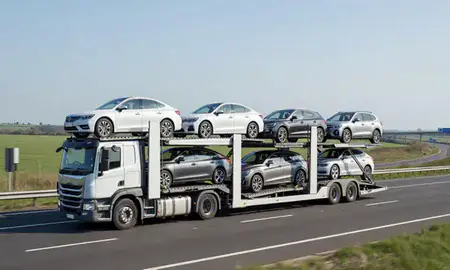Multi-level car carrier on the motorway to Milton Keynes, Buckinghamshire, United Kingdom