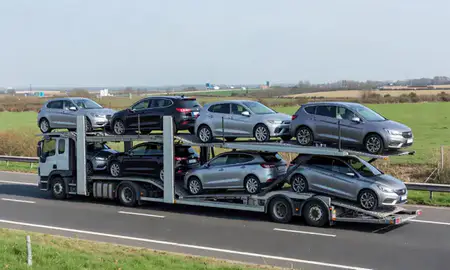 Multi-level car carrier on the motorway to Cambridge, Cambridgeshire, United Kingdom