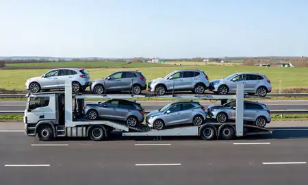 Multi-level car carrier on the motorway to Peterborough, Cambridgeshire, United Kingdom