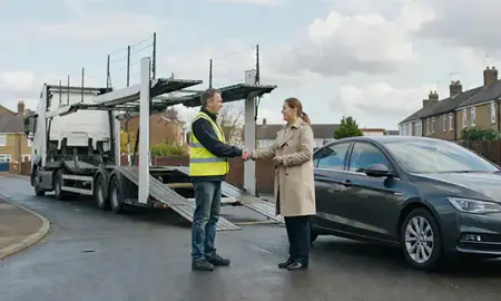 Vehicle owner beside their delivered car in Peterborough, Cambridgeshire, United Kingdom