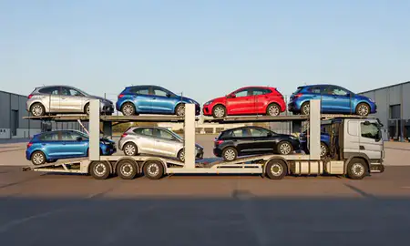 Car transporter parked in an industrial area of Cheshire, United Kingdom