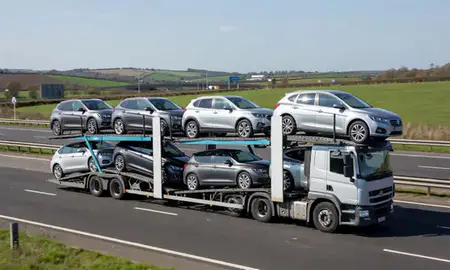 Multi-level car carrier on the motorway to Crewe, Cheshire, United Kingdom