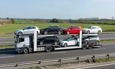 Multi-level car carrier on the motorway to Macclesfield, Cheshire, United Kingdom