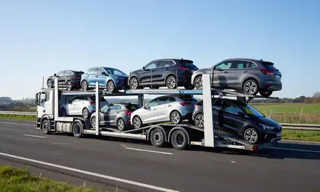 Multi-level car carrier on the motorway to Northwich, Cheshire, United Kingdom