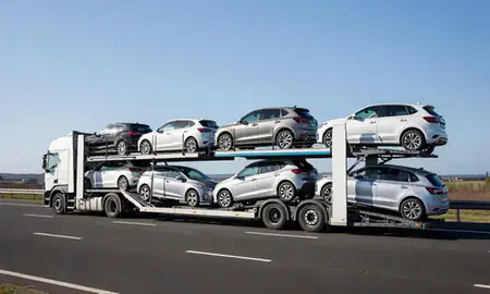 Multi-level car carrier on the motorway to Runcorn, Cheshire, United Kingdom