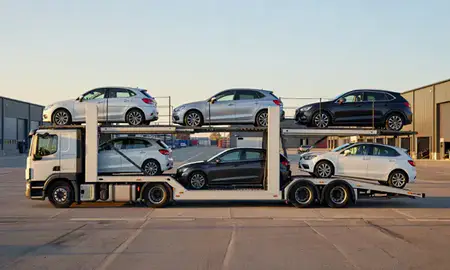 Car transporter parked in an industrial area of Runcorn, Cheshire, United Kingdom