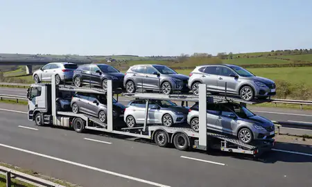 Multi-level car carrier on the motorway to Warrington, Cheshire, United Kingdom