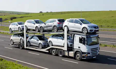 Multi-level car carrier on the motorway to Clwyd, United Kingdom
