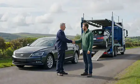 Vehicle owner beside their delivered car in Clwyd, United Kingdom