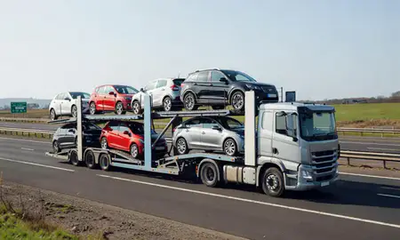 Multi-level car carrier on the motorway to Wrexham, Clwyd, United Kingdom