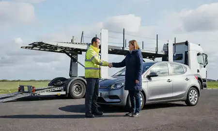Vehicle owner beside their delivered car in Wrexham, Clwyd, United Kingdom