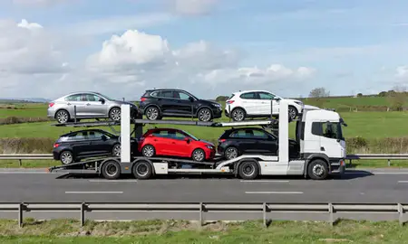 Multi-level car carrier on the motorway to County Antrim, United Kingdom