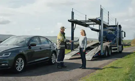 Vehicle owner beside their delivered car in County Antrim, United Kingdom