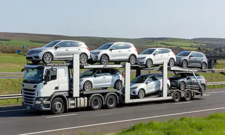 Multi-level car carrier on the motorway to Belfast, County Antrim, United Kingdom