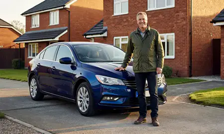 Customer with their delivered car in Lisburn, County Antrim, United Kingdom