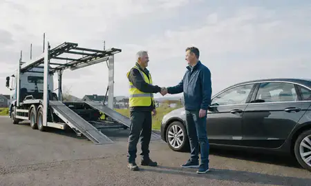 Vehicle owner beside their delivered car in Newtownabbey, County Antrim, United Kingdom