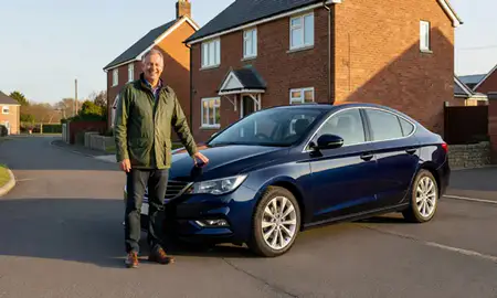 Customer with their delivered car in County Armagh, United Kingdom