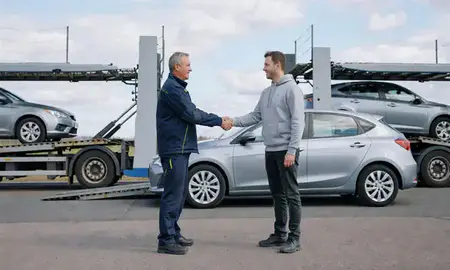 Vehicle owner beside their delivered car in Craigavon, County Armagh, United Kingdom