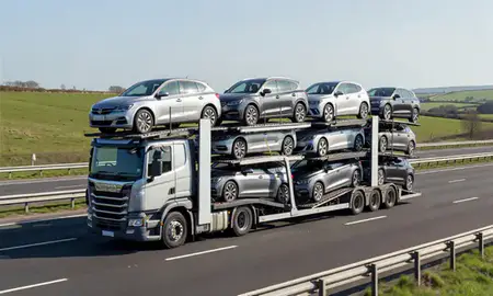 Multi-level car carrier on the motorway to County Down, United Kingdom