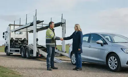 Vehicle owner beside their delivered car in County Durham, United Kingdom