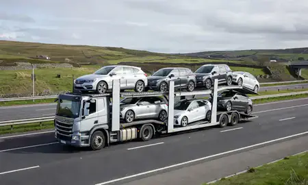 Multi-level car carrier on the motorway to Cumbria, United Kingdom