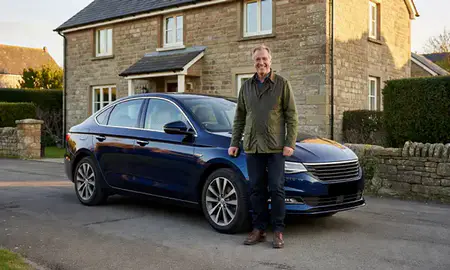 Customer with their delivered car in Carlisle, Cumbria, United Kingdom