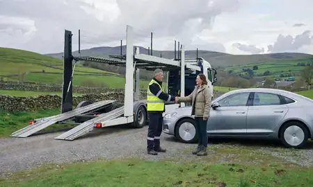 Vehicle owner beside their delivered car in Derbyshire, United Kingdom