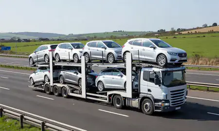 Multi-level car carrier on the motorway to Derby, Derbyshire, United Kingdom