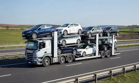 Multi-level car carrier on the motorway to Ilkeston, Derbyshire, United Kingdom