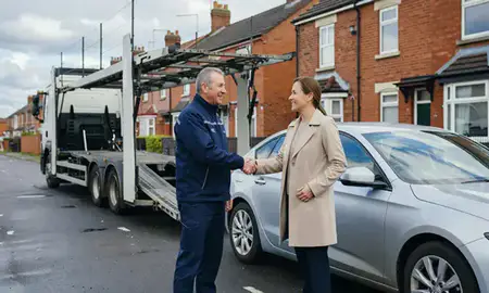 Vehicle owner beside their delivered car in Ilkeston, Derbyshire, United Kingdom