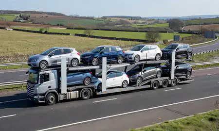 Multi-level car carrier on the motorway to Swadlincote, Derbyshire, United Kingdom