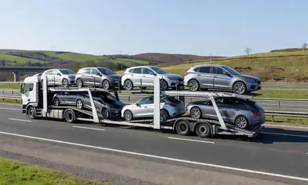 Multi-level car carrier on the motorway to Exeter, Devon, United Kingdom