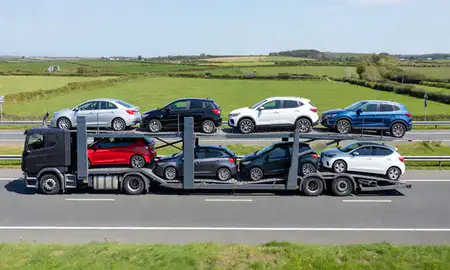 Multi-level car carrier on the motorway to Exmouth, Devon, United Kingdom