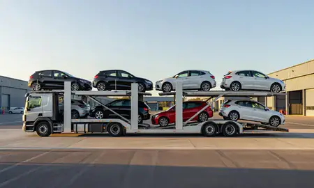Car transporter parked in an industrial area of Paignton, Devon, United Kingdom