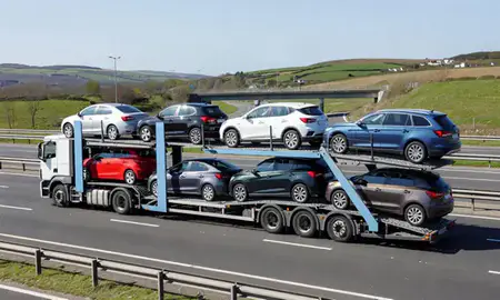 Multi-level car carrier on the motorway to Plymouth, Devon, United Kingdom